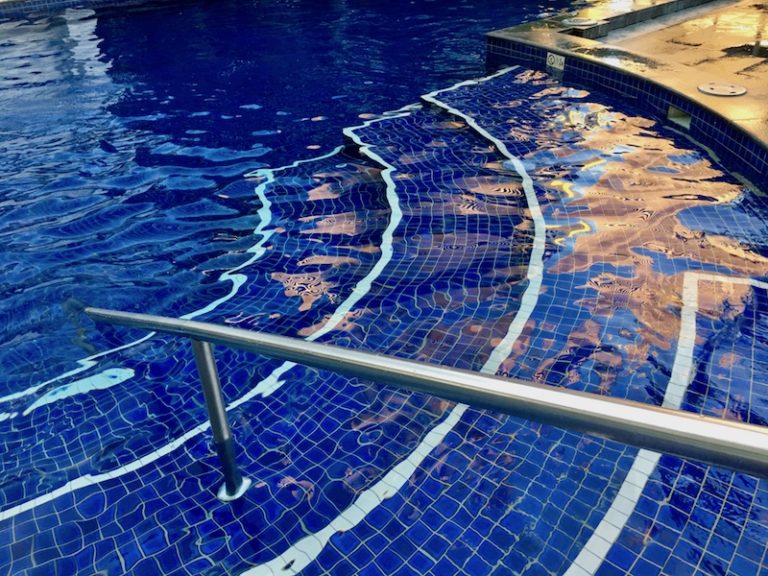 Reflections in the outdoor pool at Meriton Apartments Broadbeach, photo Therese Spruhan, April 2018